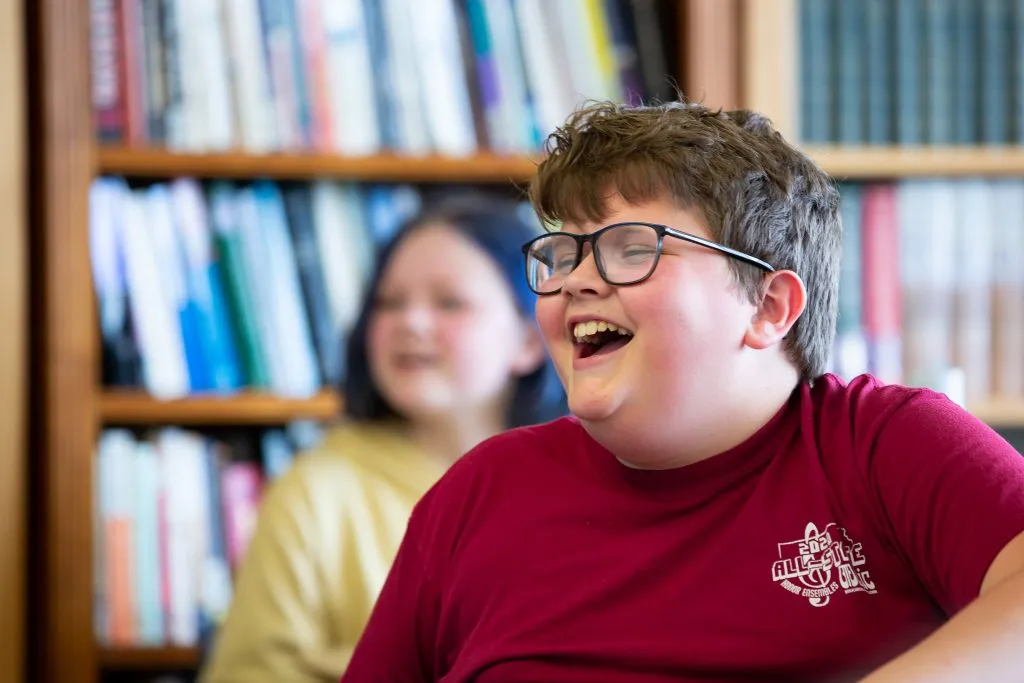 A student at Compass Academy Network laughs at the Free Middle School Summer School